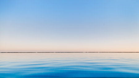 The blue transparent water in the pool merges with the sky to copy the space.