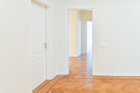 Wooden floor an apartment with white walls, empty rental property.の写真素材