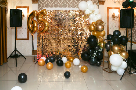 Photo area for 65th anniversary, balloons in gold color.の写真素材