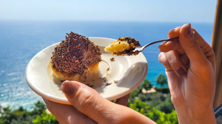 Beautiful breakfast with a piece of cake beach holiday.の写真素材