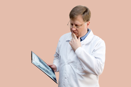 The doctor examines the X-ray picture doctor blond 40-44 years old,の写真素材