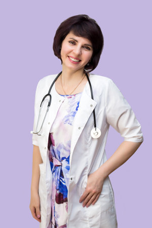 Happy girl doctor smile cutely purple background.の写真素材