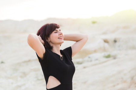 Beautiful sexy woman laughing posing the desert, photo session in Dubai.