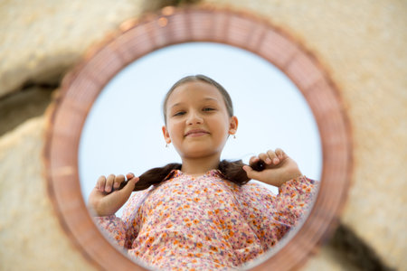 Mirror on the sand with reflection of a child, idea for photography in nature.の写真素材