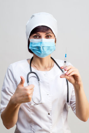 Woman doctor rejoices that there is a vaccine against the disease.の写真素材