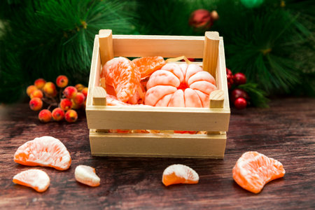 Handmade soap in the shape of orange and tangerine slices on a wooden table.の写真素材