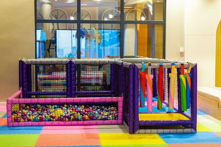 Playroom for children, interior, bright colored furniture.