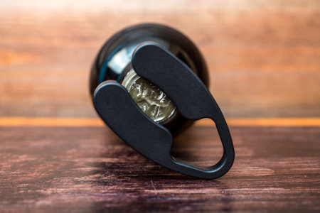 Wine bottle bottle opener on wooden background.