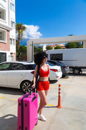 Woman goes on her dream trip, waiting for a wonderful vacation.の写真素材