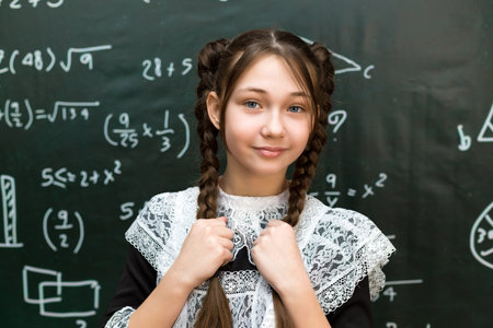 Retro School Elegance: Girl in Soviet Uniform with Braided Hair.の写真素材