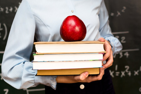 Apple on school books, food concept educational institution.