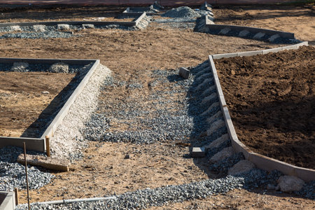 Construction of flower beds new park, installation of border stones.の写真素材