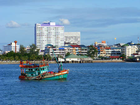 Fishing boat on the sea and cityのeditorial素材
