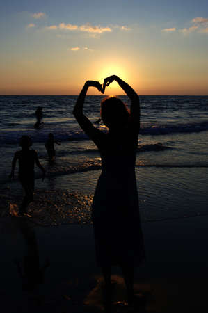 Women are in love with the sunの写真素材