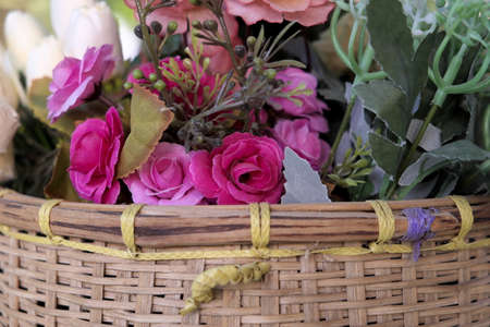 Bouquet with rose bush in the basketの写真素材