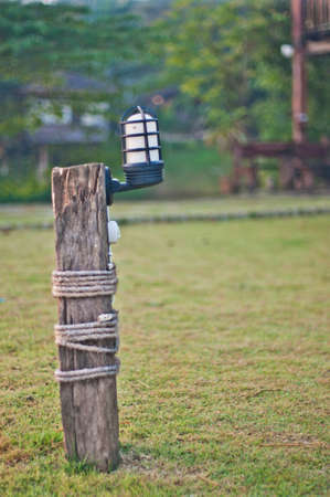 Green lawn with garden lampの写真素材