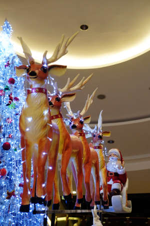Santa Claus with sledge, deers and Christmas presents の写真素材