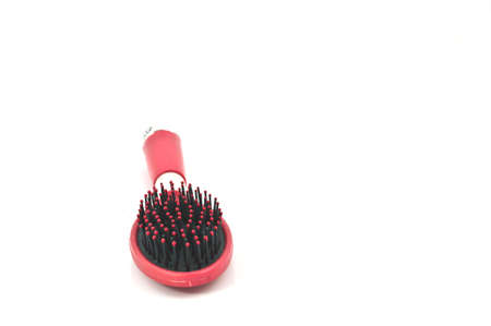 Red hairbrush isolated on a white の写真素材