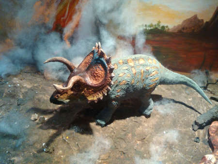 Dinosaurs model on rock mountain backgroundの写真素材