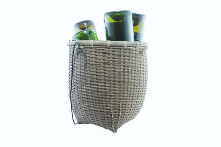 wine in wicker basket isolated on white backgroundの写真素材