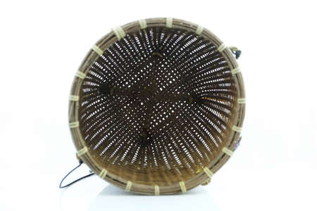 Empty wicker basket isolated on white backgroundの写真素材