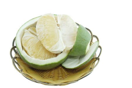 Green pomelo citrus fruit on wood Basket white background