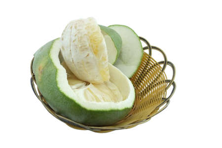 Green pomelo citrus fruit on wood Basket white backgroundの写真素材