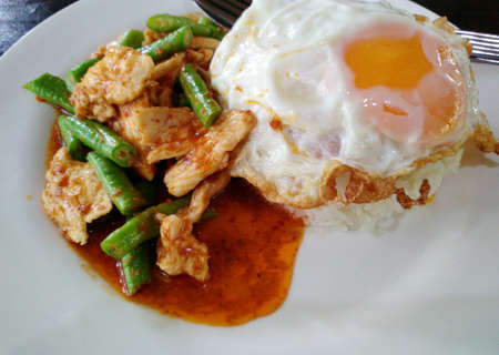 stir fried spicy pork and fried egg, fast food Thailandの写真素材