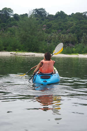 Family on kayaks and canoe tourの写真素材