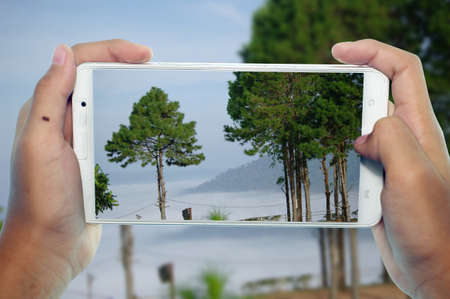 travel concept take photography mountain by phoneの写真素材