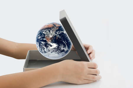 boy open Earth in boxの写真素材