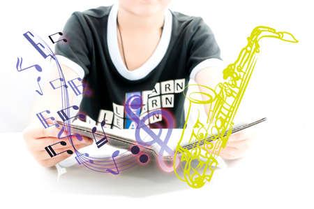 Boy learning for new experience with saxophone for begin playの写真素材