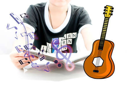Boy learning for new experience with guitar for begin playの写真素材