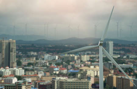 Wind turbine power generators and sunset. Alternative renewable energy productionの写真素材
