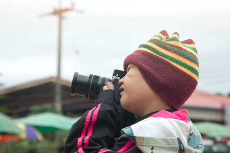 Asian boy learning to shoot photoの写真素材