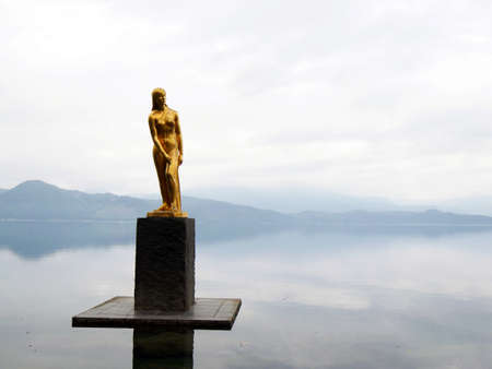 Akita, Japan - Jul 13, 2017: Lake Tazawa with The statue of the Tatsukoのeditorial素材