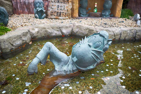 SAKAIMINATO, JAPAN - Novermber 26, 2015: Bronze statues of 'GeGeGe no Kitaro' Main character on...
