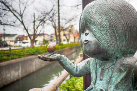 SAKAIMINATO, JAPAN - Novermber 26, 2015: Bronze statues of 'GeGeGe no Kitaro' Main character on Mizuki Shigeru road, Sakaiminato, Tottori.のeditorial素材
