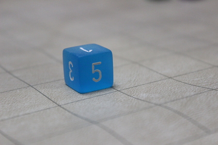6-sided die on gridの写真素材