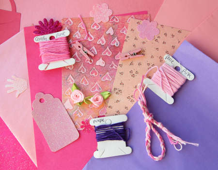 Pastel pink and purple card making composition  threads, craft paper, craft elementsの写真素材