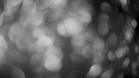 Silver lights bokeh defocus abstract background. Silver Festive Christmas. Glitter twinkled bright...