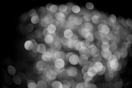 Silver lights bokeh defocus abstract background. Silver Festive Christmas. Glitter twinkled bright...