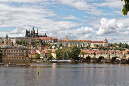 Charles Bridge is a historic bridge that crosses the Vltava river and Prague Castle is a castle complex in Prague, Czech R epublicのeditorial素材