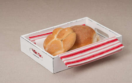 Buns On Tray With Napkin On Natural Linen Background