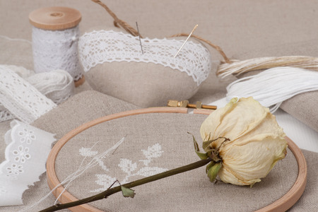 Sewing And Embroidery Craft Kit. Dried Rose. Natural Linen Backgroundの写真素材
