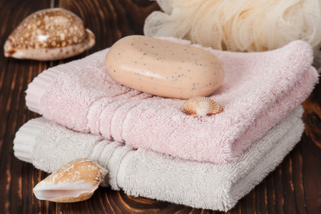 Soap, Towels. Sea Shells. Wooden Background.の写真素材