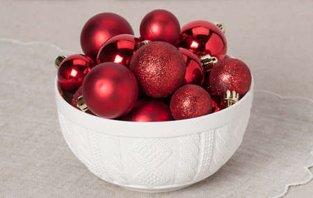 Christmas Decoration. Red Balls And Bells. Natural Linen Background.の写真素材