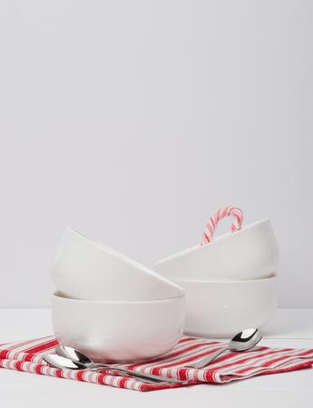 Christmas Candy Cane. White Bowls. Red White Napkin.の写真素材