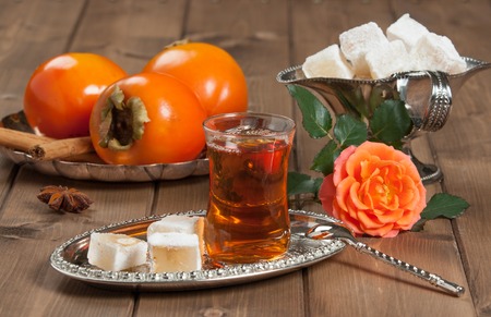 Turkish Delight. Hot Tea. Persimmon. Rose. Silver Dishの写真素材