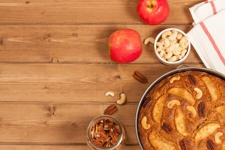 Homebaked Whole Wheat Flour Pie With Apples, Cinnamon, Cashew And Pecan Nuts. In Baking Trayの写真素材